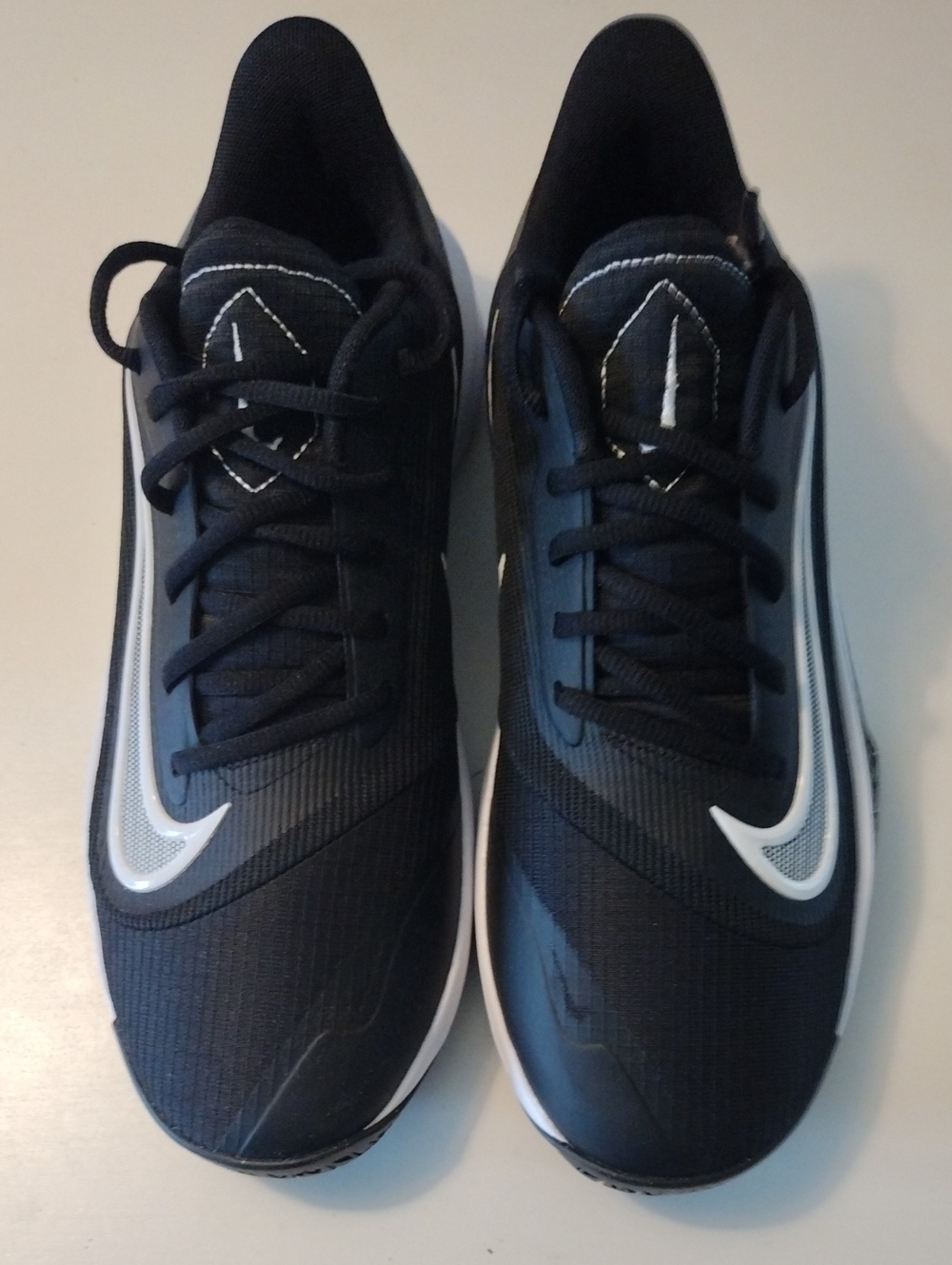 Nike Precision 7 Men’s Black Athletic Sneakers with White Swoosh.